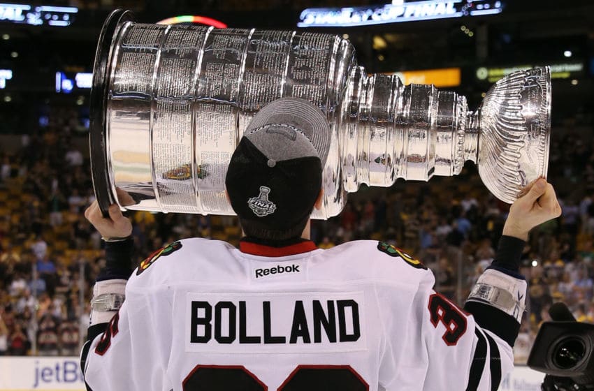 BOSTON, MA - JUNE 24: Dave Bolland #36 of the Chicago Blackhawks hoists the Stanley Cup after defeating the Boston Bruins in Game Six of the 2013 NHL Stanley Cup Final at TD Garden on June 24, 2013 in Boston, Massachusetts. The Chicago Blackhawks defeated the Boston Bruins 3-2. (Photo by Bruce Bennett/Getty Images)