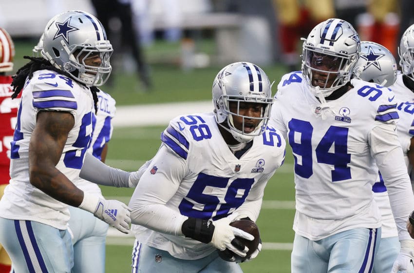 ARLINGTON, TEXAS - DECEMBER 20: Defensive end Aldon Smith #58 of the Dallas Cowboys celebrates a fumble recovery against the San Francisco 49ers during the first quarter at AT&T Stadium on December 20, 2020 in Arlington, Texas. (Photo by Tom Pennington/Getty Images)