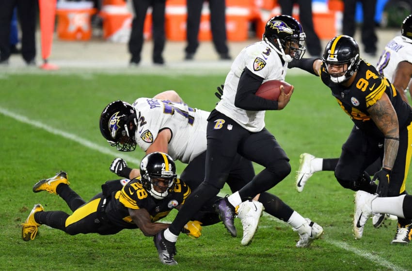 PITTSBURGH, PENNSYLVANIA - DECEMBER 02: Robert Griffin III #3 of the Baltimore Ravens tries to evade a sack from Mike Hilton #28 and Tyson Alualu #94 of the Pittsburgh Steelers during the third quarter at Heinz Field on December 02, 2020 in Pittsburgh, Pennsylvania. (Photo by Joe Sargent/Getty Images)