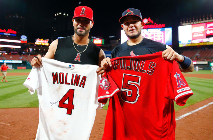 ST LOUIS, MO - JUNE 23: Albert Pujols #5 of the Los Angeles Angels of Anaheim and Yadier Molina #4 of the St. Louis Cardinals pose for a photo after exchanging jerseys after their game at Busch Stadium on June 23, 2019 in St. Louis, Missouri. (Photo by Dilip Vishwanat/Getty Images)