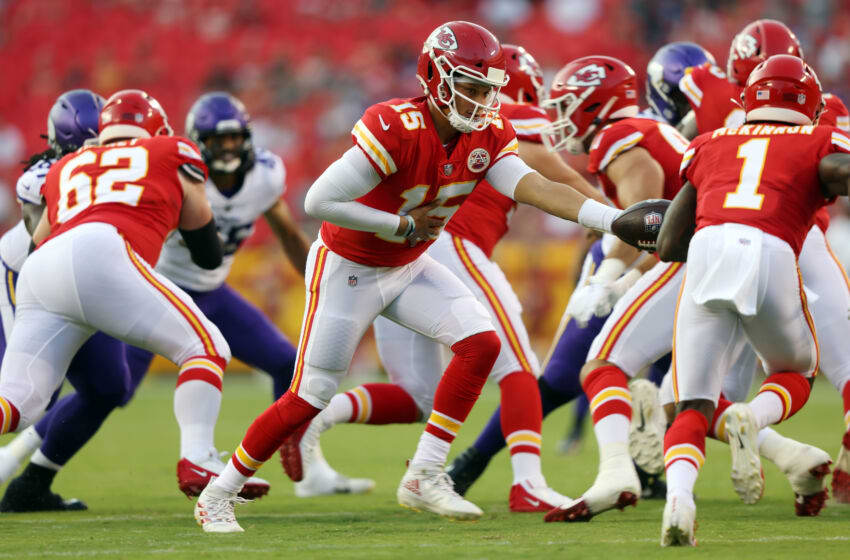 KANSAS CITY, MISSOURI - AUGUST 27: Quarterback Patrick Mahomes #15 of the Kansas City Chiefs hands off to running back Jerick McKinnon #1 during the 1st quarter of the preseason game against the Minnesota Vikings at Arrowhead Stadium on August 27, 2021 in Kansas City, Missouri. (Photo by Jamie Squire/Getty Images)
