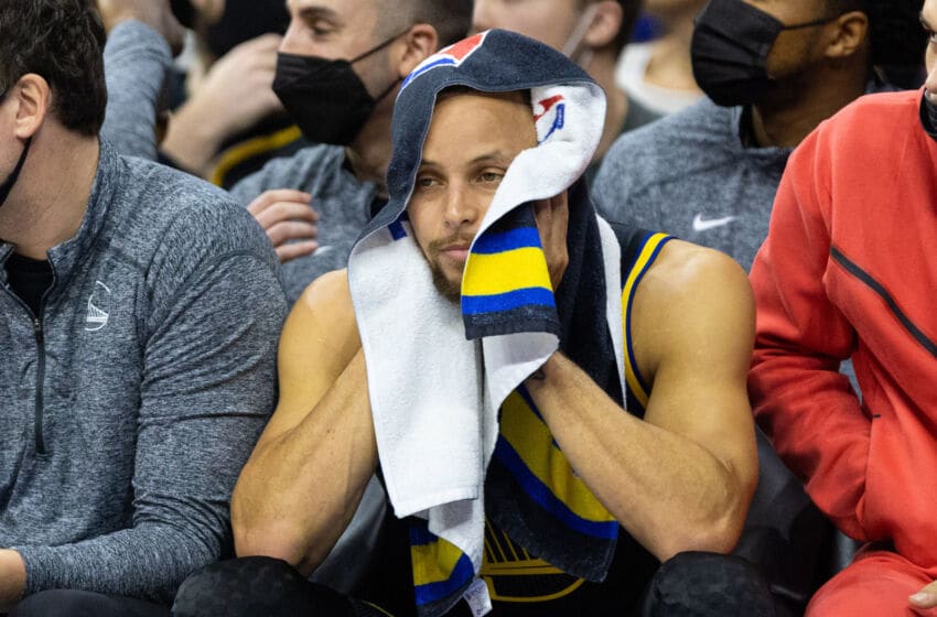 Dec 11, 2021; Philadelphia, Pennsylvania, USA; Golden State Warriors guard Stephen Curry (30) looks on from the bench during the third quarter against the Philadelphia 76ers at Wells Fargo Center. Mandatory Credit: Bill Streicher-USA TODAY Sports