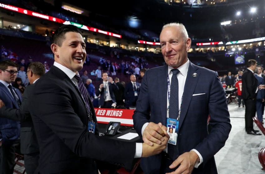 VANCOUVER, BRITISH COLUMBIA - JUNE 21: (L-R) Shawn Horcoff and Ralph Krueger attend the first round of the 2019 NHL Draft at Rogers Arena on June 21, 2019 in Vancouver, Canada. (Photo by Bruce Bennett/Getty Images)