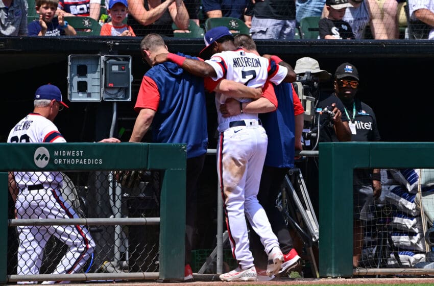 CHICAGO, ILLINOIS - MAY 29: Tim Anderson #7 of the Chicago White Sox is helped off the field by medical staff after an apparent injury in the fifth inning against the Chicago Cubs at Guaranteed Rate Field on May 29, 2022 in Chicago, Illinois. (Photo by Quinn Harris/Getty Images)