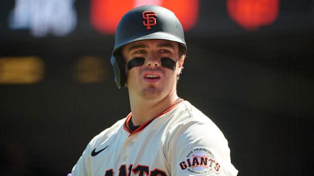 Drew Gilbert with his teammates in the Giants' clubhouse