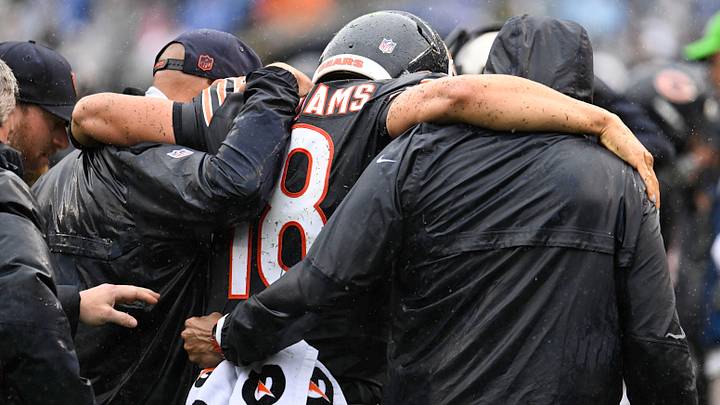 Caleb Williams helped from the field after suffering a hamstring injury against the Minnesota Vikings
