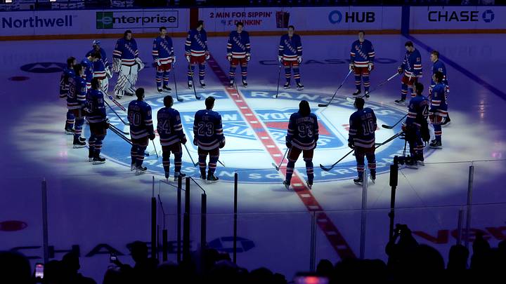 New York Rangers players gathered at center ice during introductions for the October 1 2026 home opener at Madison Square Garden