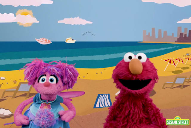 Elmo and Abby search for the color green at the beach.
