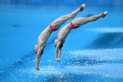 China's Xie Siyi and Wang Zongyuan in the men's synchronized 3-meter springboard diving final at the Tokyo Olympics.