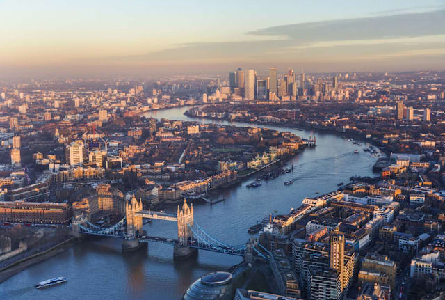 An aerial view of the river Thames at sunset. 
