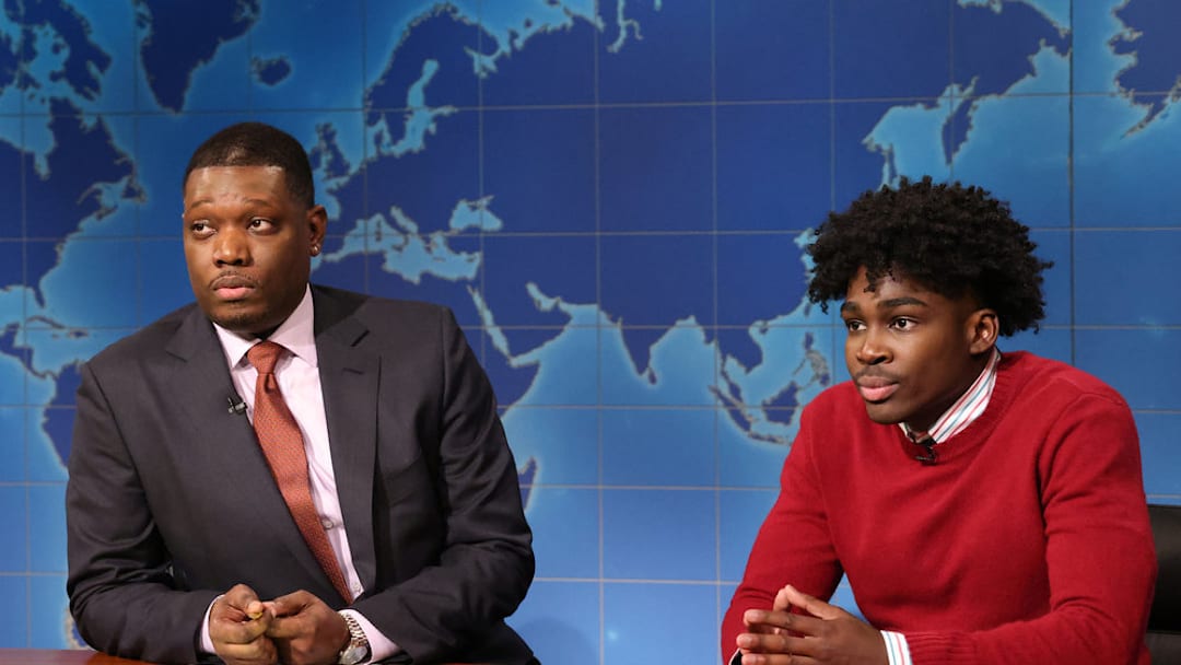 SATURDAY NIGHT LIVE -- Episode 1893 -- Pictured: (l-r) Anchor Michael Che and Kam Patterson as Tyson, Michael Ches Nephew during Weekend Update on Saturday, December 20, 2025 -- (Photo by: Will Heath/NBC) SATURDAY NIGHT LIVE -- Episode 1893 -- Pictured: (l-r) Anchor Michael Che and Kam Patterson as Tyson, Michael Ches Nephew during Weekend Update on Saturday, December 20, 2025 -- (Photo by: Will Heath/NBC)