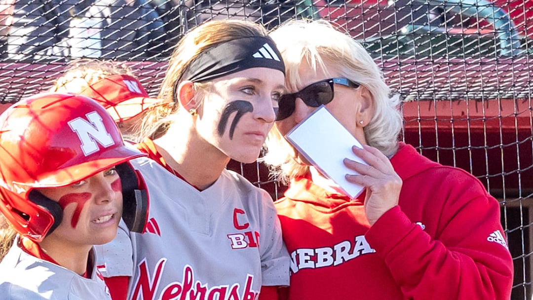 Nebraska coach Rhonda Revelle and pitcher Jordy Frahm discuss strategy against Omaha at Bowlin Stadium.