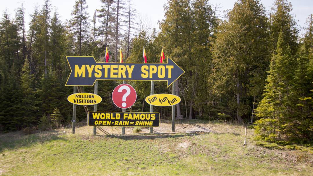 Sign reading "Mystery Spot" in the pine trees