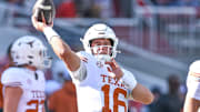 Texas Longhorns quarterback Arch Manning throws a pass in warmups before a game against Arkansas at Razorback Stadium in Fayetteville, Ark.