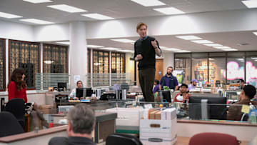 THE PAPER -- "Pilot" Episode -- Pictured: (l-r) Sabrina Impacciatore as Esmeralda, Oscar Nunez as Oscar, Domhnall Gleeson as Ned, Gbemisola Ikumelo as Adelola  (Photo by: Aaron Epstein/PEACOCK)