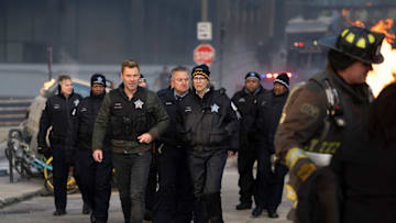 CHICAGO FIRE -- "In The Trenches: Part I" Episode 13011 -- Pictured: (l-r) Patrick John Flueger as Officer Adam Ruzek, Amy Morton as Desk Sgt. Trudy Platt -- (Photo by: Peter Gordon/NBC)