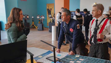 CHICAGO P.D. -- "In The Trenches: Part III" Episode 12014 -- Pictured: (l-r) Marina Squerciati as Officer Kim Burgess, Taylor Kinney as Kelly Severide, Dermot Mulroney as Chief Dom Pascal -- (Photo by: Elizabeth Sisson/NBC)