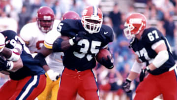 Robert Holcombe (35), who attended the University of Illinois from 1994-97 and ended his career with the Illini football team as its all-time leading rusher (4,105 yards), was inducted into the school's athletics Hall of Fame on Friday and will serve as the football team's honorary captain for Saturday's home game against Purdue. 