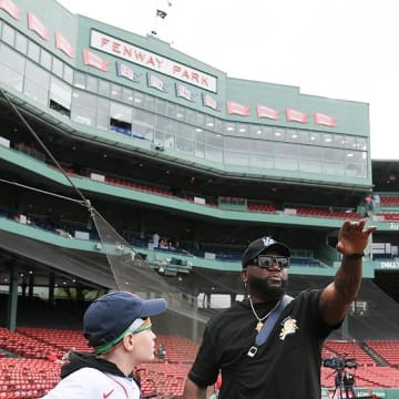 May 15, 2024; Boston, Massachusetts, USA; Former Red Sox first baseman and designated hitter David Ortiz visits a young fan from the Make A Wish Foundation before a game against the Tampa Bay Rays at Fenway Park.