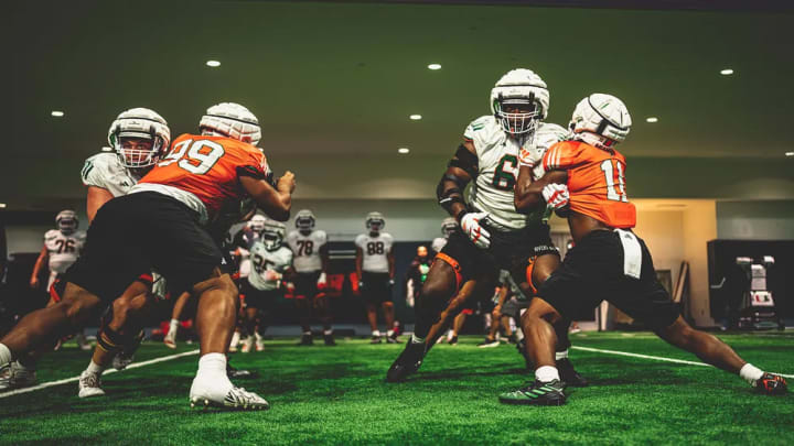 Miami Hurricanes offensive and defensive line battling against each other during fall camp