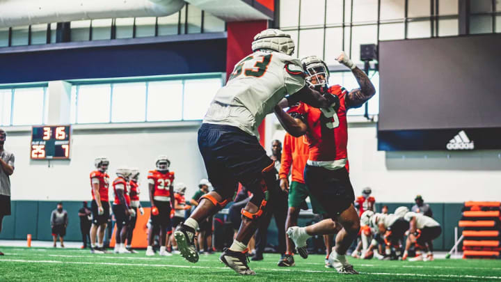 Elija Lofton (No. 9) working on his blocking against Joe Enguidanos (No. 53)