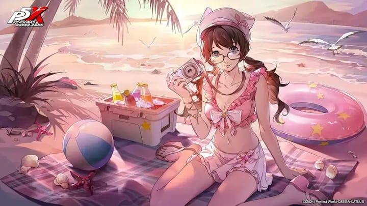 Moko in her pink swinsuit, sitting on a towel on the beach at sunset.