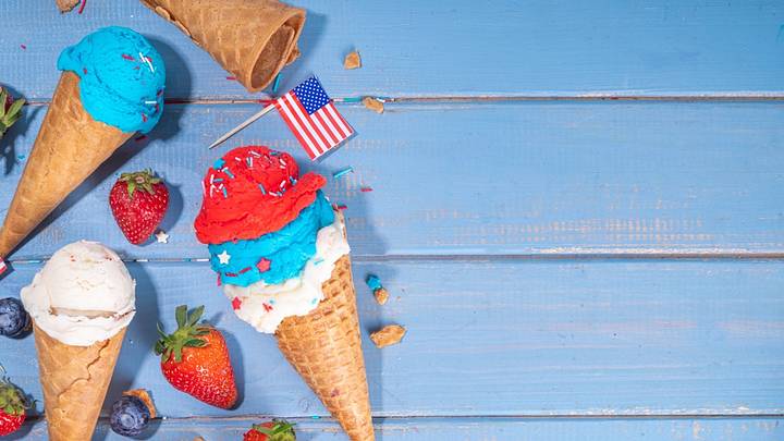 Ice cream and American flag on blue picnic table