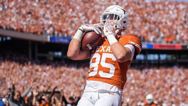 Texas Longhorns tight end Gunnar Helm (85) celebrates the touchdown against Oklahoma Sooners defense in the second quarter during an NCAA college football game at the Cotton Bowl on Saturday, Oct. 7, 2023 in Dallas, Texas. This game makes up the119th rivalry match up.