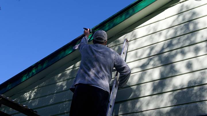 Time to paint the house, preparation has already begun with pink primer on the dark green barge board Time to paint the house, preparation has already begun with pink primer on the dark green barge board