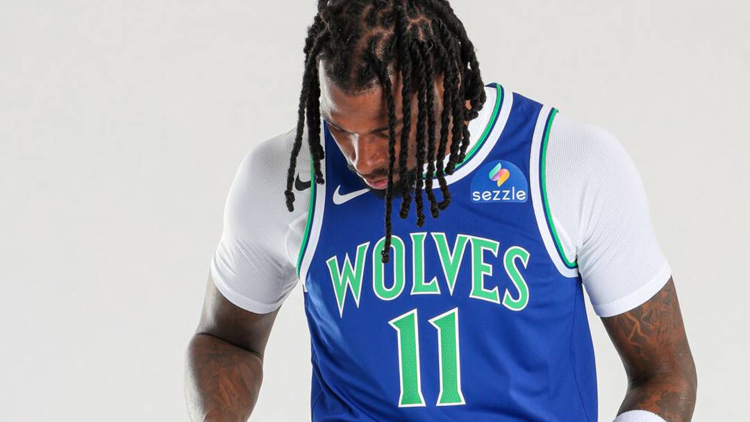 Naz Reid models one of the Timberwolves' new uniforms 