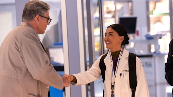 CHICAGO MED -- "Spill Your Guts" Episode 1112 -- Pictured: (l-r) Oliver Platt as Dr. Daniel Charles, Brianne Tju as Amira 
