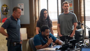 CHICAGO PD -- "Canaryville" Episode 1303 -- Pictured: (l-r) Jason Beghe as Hank Voight, LaRoyce Hawkins as Officer Kevin Atwater, Arienne Mandi as Eva Imani, Patrick John Flueger as Officer Adam Ruzek -- 
