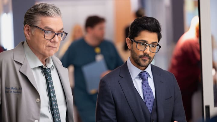 CHICAGO MED -- "The Cost of Living" Episode 1114 -- Pictured: (l-r) Oliver Platt as Dr. Daniel Charles, Manish Dayal as Dr. Theo Rabari 