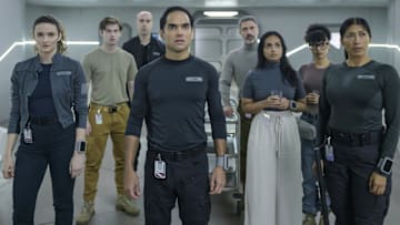 THE ARK -- "We Dont Kill Our Own" Episode 208 -- Pictured: (l-r) Christie Burke as Lt. Sharon Garnet, Ryan Adams as Angus Medford, Pavle Jerinic as Felix Strickland, Reece Ritchie as Lt. Spencer Lane, Jadran Malkovich as Dr. Marsh, Shalini Peiris as Dr. Sanjivni Kabir, Stacey Read as Alicia Nevins, Diana Bermudez as Kimi -- (Photo by: Aleksandar Letic/Ark TV Holdings, Inc./SYFY)