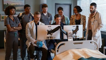BRILLIANT MINDS -- "The Man from Grozny" Episode 107 -- Pictured: (l-r) Ashleigh LaThrop as Ericka Kinney, Spence Moore II as Jacob Nash, Teddy Sears as Dr. Josh Nicols, Alex MacNicoll as Dr. Van Markus, Brendan Hines as Dr. Simon Gadson, Aury Krebs as Dr. Dana Dang, Tamberla Perry as Dr. Carol Pierce, Zachary Quinto as Dr. Oliver Wolf