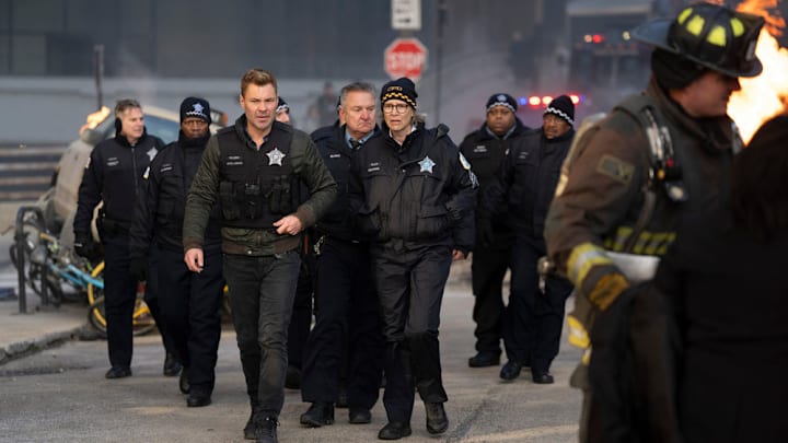 CHICAGO FIRE -- "In The Trenches: Part I" Episode 13011 -- Pictured: (l-r) Patrick John Flueger as Officer Adam Ruzek, Amy Morton as Desk Sgt. Trudy Platt -- (Photo by: Peter Gordon/NBC)