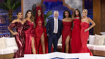 THE REAL HOUSEWIVES OF DUBAI -- Season:2 -- Pictured: (l-r) Lesa Milan, Taleen Marie, Chanel Ayan, Andy Cohen, Caroline Brooks, Sara Al Medani, Caroline Stanbury -- (Photo by: Clifton Prescod/Bravo)