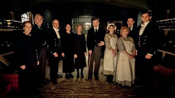 NBC'S RETURN TO DOWNTON ABBEY: A GRAND EVENT -- "Downton Abbey" -- Pictured: (l-r) Phyllis Logan as Mrs. Hughes, Jim Carter as Mr. Carson, Kevin Doyle as Mr. Molesley, Raquel Cassidy as Miss Baxter, Joanne Froggatt as Anna Bates, Brendan Coyle as Mr. Bates, Sophie McShera as Daisy, Lesley Nicol as Mrs. Patmore, Robert James-Collier as Thomas Barrow and Michael C. Fox as Andy -- (Photo by: Jaap Buitendijk/Focus Features)