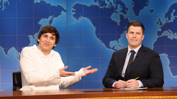 SATURDAY NIGHT LIVE -- Episode 1895 -- Pictured: (l-r) Marcello Hernández and anchor Colin Jost during Weekend Update on Saturday, January 24, 2026 -- (Photo by: Will Heath/NBC)