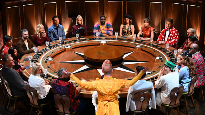 THE TRAITORS -- "Show Me Your Faces" Episode 403 -- Pictured: (l-r) Dorinda Medley, Michael Rapaport, Natalie Anderson, Rob Rausch, Mark Ballas, Tara Lipinski, Stephen Colletti, Caroline Stanbury, Ron Funches, Maura Higgins, Lisa Rinna, Colton Underwood, Donna Kelce, Eric Nam, Monét X Change, Caroline Stanbury, Johnny Weir -- (Photo by: Euan Cherry/Peacock)