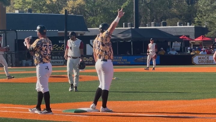 Matthew Russo salutes The Roost and 16oz. Lounge at Pete Taylor Park after an RBI single. Matthew Russo salutes The Roost and 16oz. Lounge at Pete Taylor Park after an RBI single.