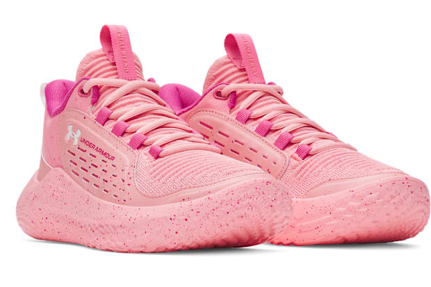 Side view of pink Under Armour shoes.