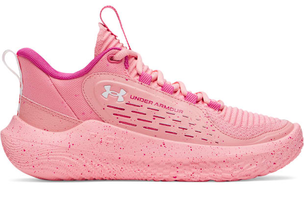 Side view of pink Under Armour shoes.