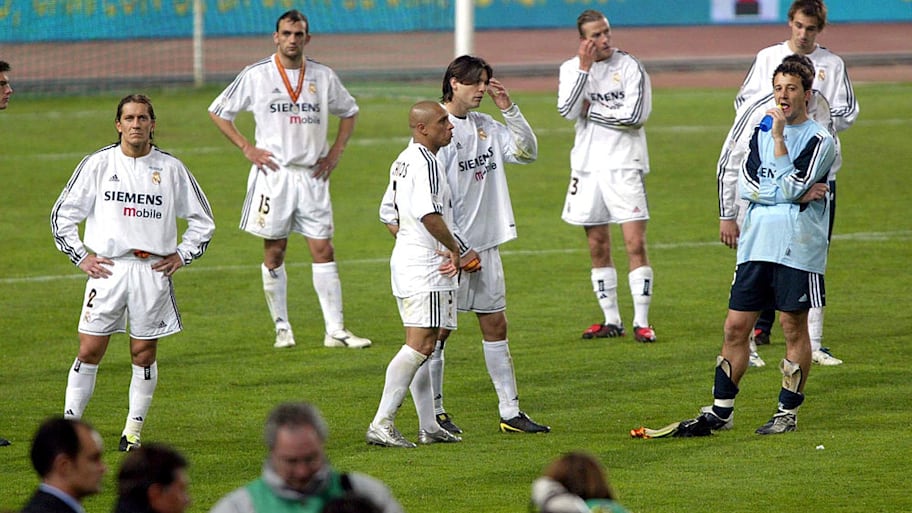Real Madrid players collect runners-up medals.