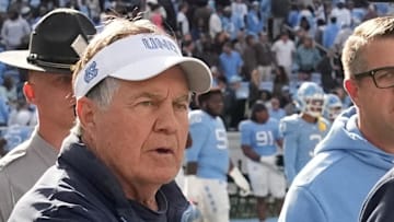 Oct 25, 2025; Chapel Hill, North Carolina, USA; North Carolina Tar Heels head coach Bill Belichick shakes Virginia Cavaliers head coach Tony Elliott hand after the Tar Heels lose to Virginia in overtime at Kenan Stadium. Mandatory Credit: Bob Donnan-Imagn Images
