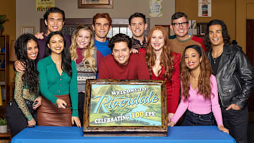 Riverdale -- “Chapter One Hundred: The Jughead Paradox” -- Image Number: RVD605_BTS_0001r -- Pictured: Vanessa Morgan, Charles Melton, Camila Mendes, Lili Reinhart, K.J. Apa, Cole Sprouse, Casey Cott, Madelaine Petsch, Roberto Aguirre-Sacasa, Erinn Westbrook and Drew Ray Tanner -- Photo: Michael Simon/The CW -- © 2021 The CW Network, LLC. All Rights Reserved.