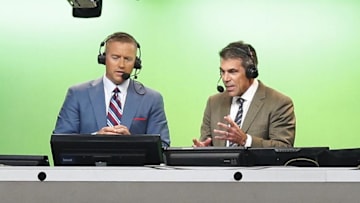 Aug 30, 2014; Arlington, TX, USA; ESPN broadcasters Kirk Herbstreit (right) and Chris Fowler announce the game with the Florida State Seminoles playing against the Oklahoma State Cowboys at AT&T Stadium. Mandatory Credit: Matthew Emmons-Imagn Images