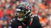 Houston Texans quarterback C.J. Stroud scrambles during the first half against the Denver Broncos.