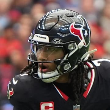 Houston Texans quarterback C.J. Stroud scrambles during the first half against the Denver Broncos.