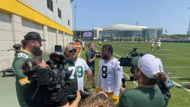 Green Bay Packers running back Josh Jacobs hangs out with WWE stars Braun Strowman and Big Daddy Otis at Ray Nitschke Field.